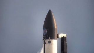 A Rocket Lab Electron rocket capped with NASA's PREFIRE climate satellite sits on the launch pad in New Zealand on Friday, May 31, 2024.