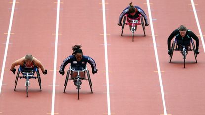 Anne Wafula-Strike of Great Britain races with Hannah Cockroft of Great Britain in the Women's 100m T54 final during the Visa