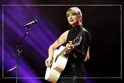 Taylor Swift playing a guitar on stage