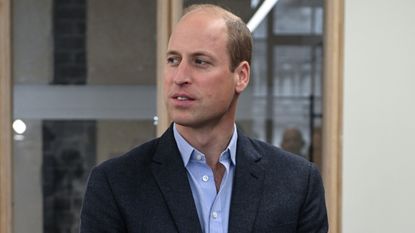 Prince William, Prince of Wales listens to staff from SatVu during a visit to Sustainable Ventures on October 05, 2023