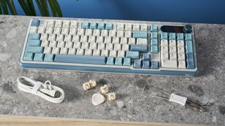 A Royal Kludge S98 wireless mechanical keyboard with blue, teal and white double-shot ABS keycaps