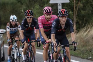 Geraint Thomas rides behind his Ineos teammates