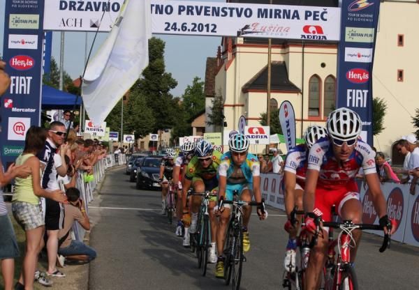 Riders pass through the finish line on the circuit