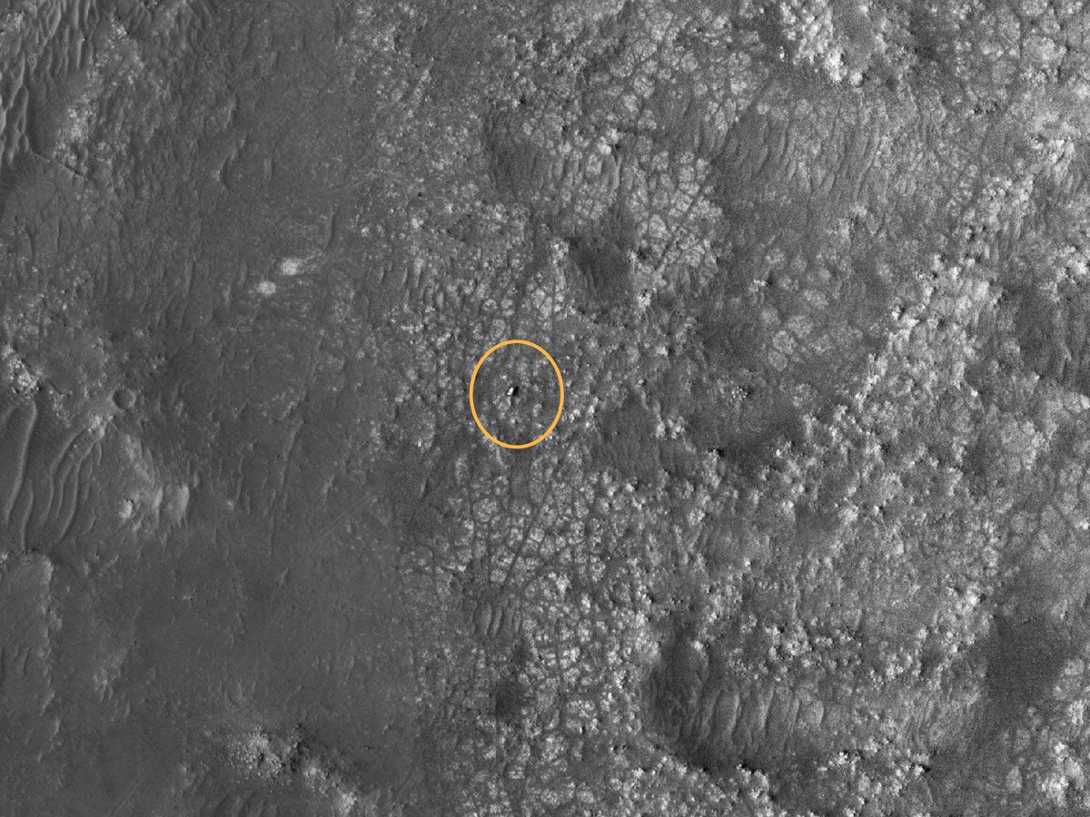 The Perseverance rover, circled in yellow, seen from space on Mars on March, 31 2022.
