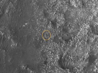 The Perseverance rover, circled in yellow, seen from space on Mars on March, 31 2022.