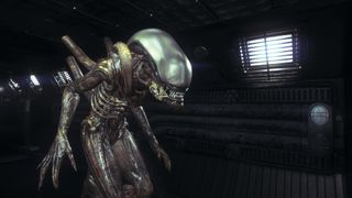 Alien: Isolation screenshot of a xenomorph walking though a dimly lit space ship interior