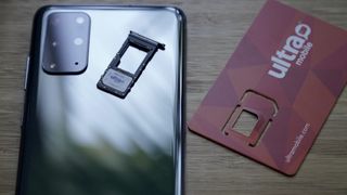 Ultra Mobile SIM next to an S20+