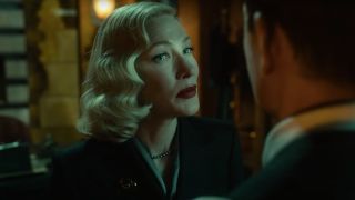 Cate Blanchett with a sly look on her face in Nightmare Alley.