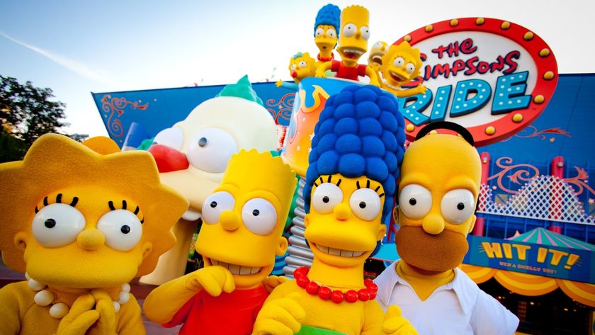 Simpsons characters in front of Simpsons ride at universal studios florida