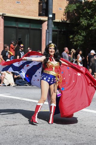 A cosplayer dressed as a Wonder Woman walks in the 2024 Dragon Con Parade on August 31, 2024 in Atlanta, Georgia.