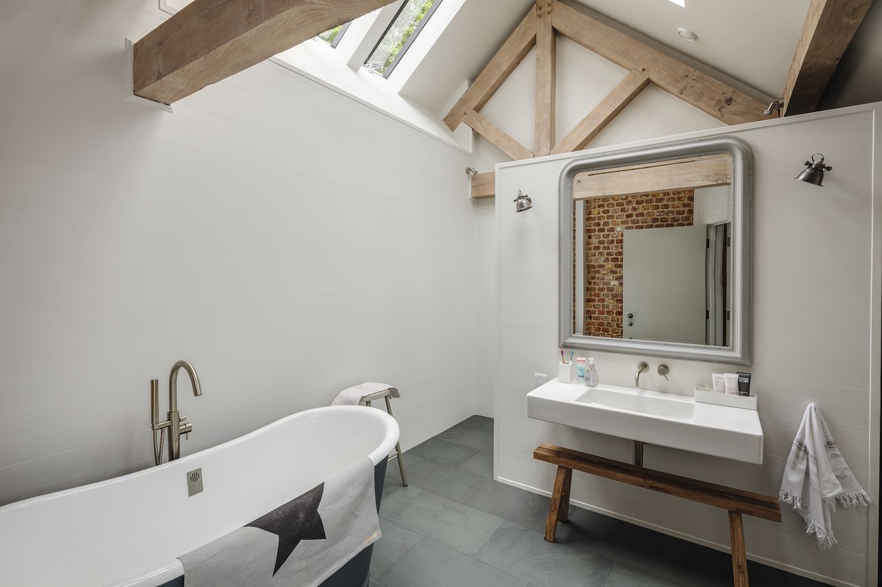 grey and white bathroom in oak frame house
