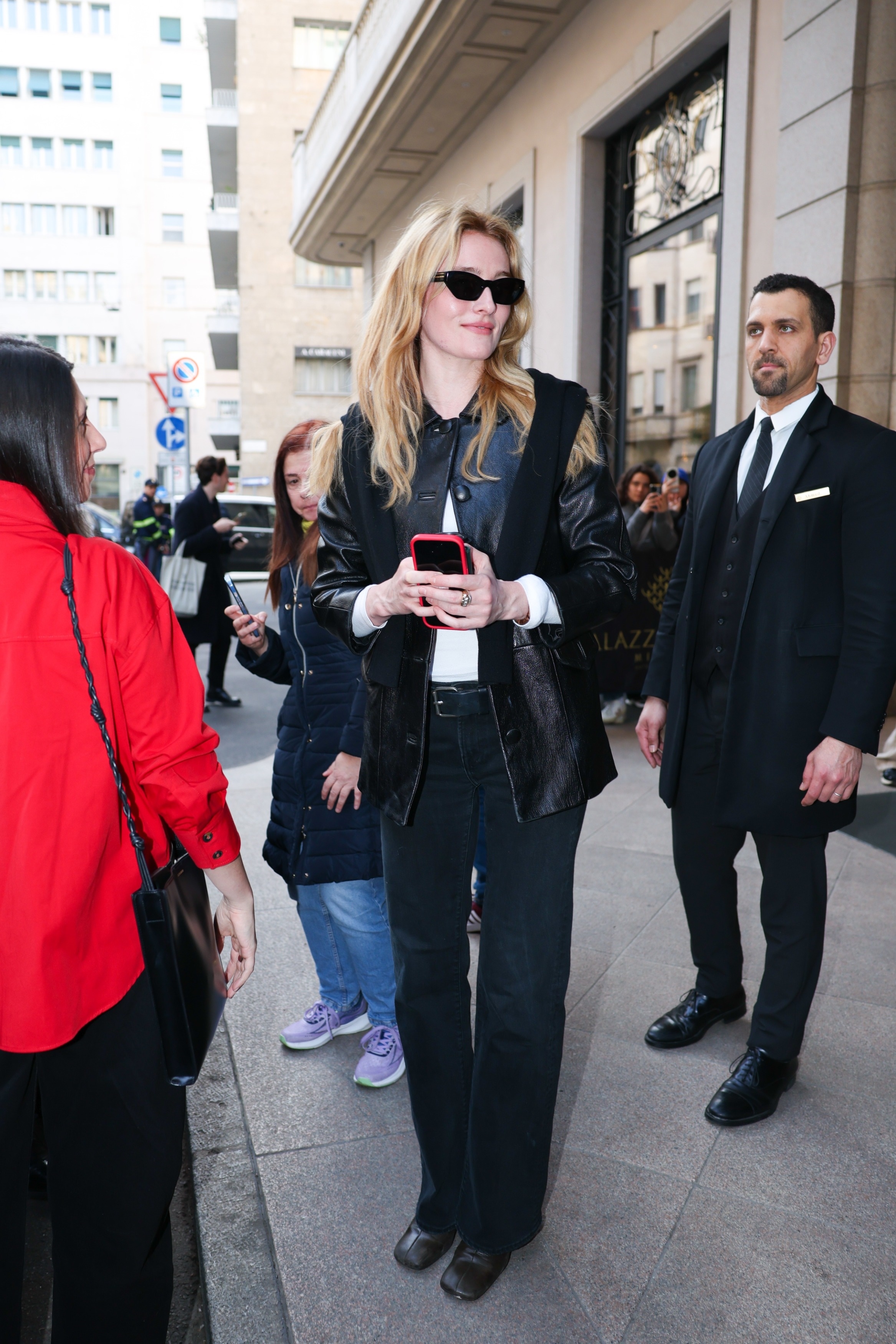 Sarah Pidgeon arrived at Milan Fashion Week wearing black cigarette jeans, a leather jacket, and a sweater on top