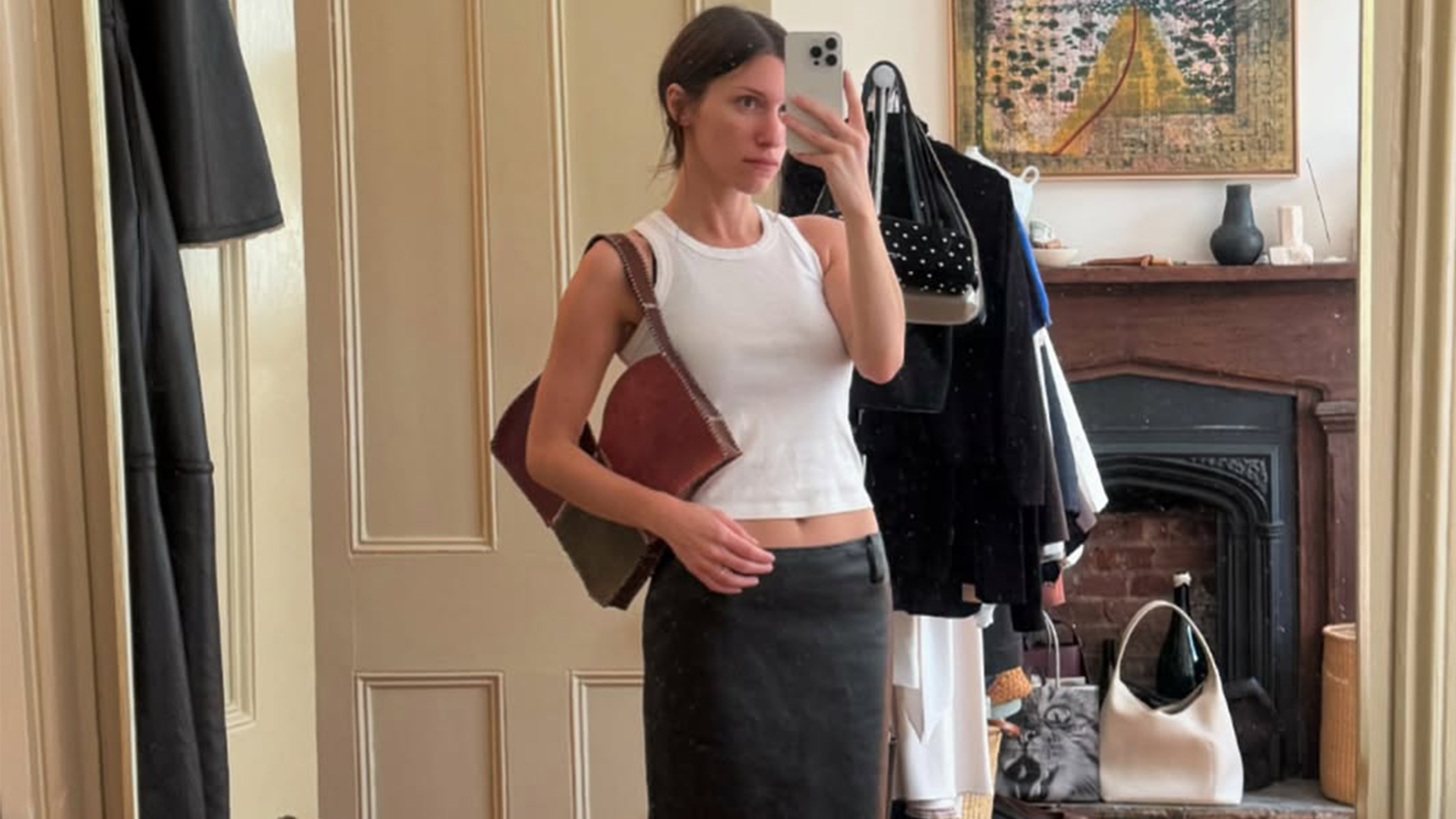 Laura Reilly in a white tank top.