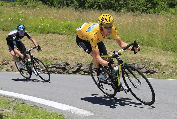 Race leader Bradley Wiggins (Sky) gets low on the descent with teammate Chris Froome in tow