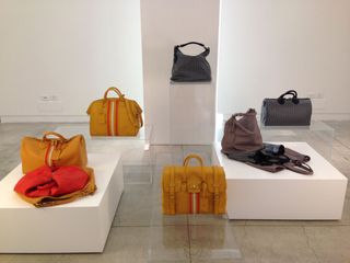 A colourful display of leather handbags and other leather items