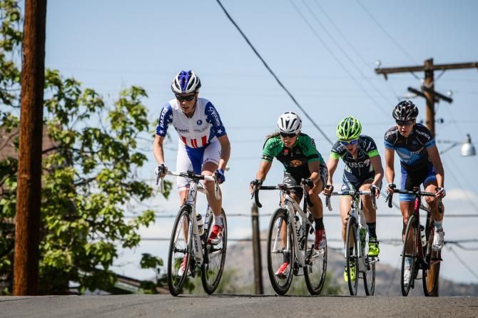 The women&rsquo;s break crests the climb on the back of the course.