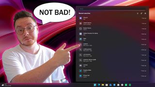 Man pointing at Windows 11's new search UI. 