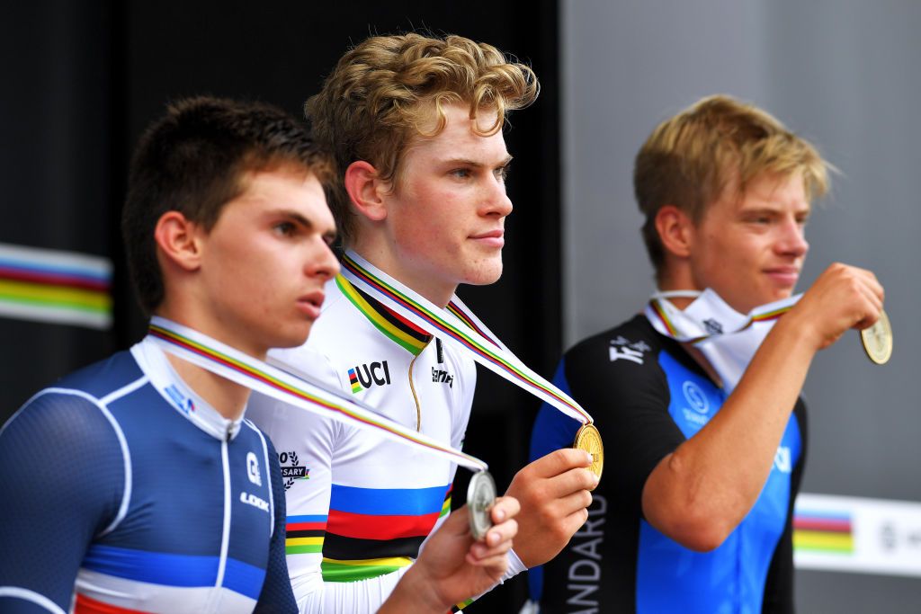 Per Strand Hagenes (Norway) shows off his medal and rainbow jersey
