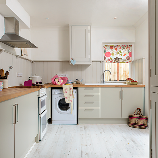 kitchen with white wall and washing machine