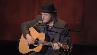 Steven Wright playing guitar in When The Leaves Blow