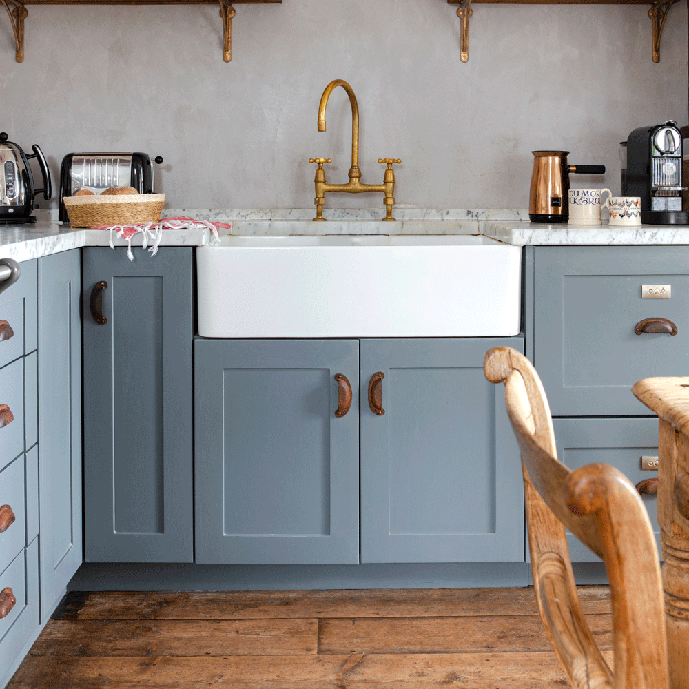 grey kitchen cabinets brass taps and door handles