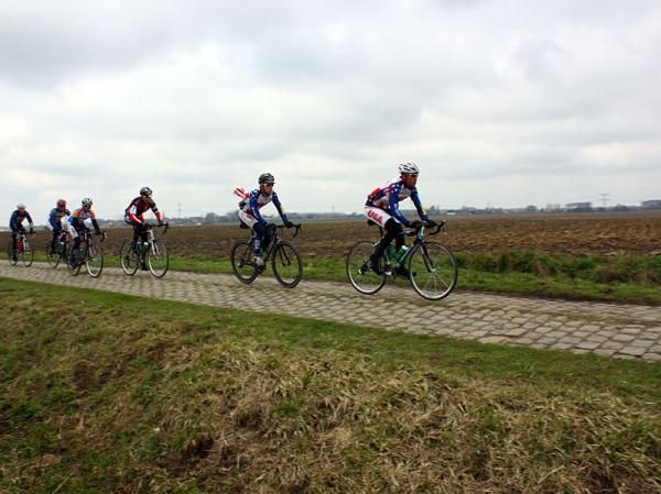 The young US development riders familiarise themselves with the cobbles.