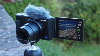 Sony ZV-1 on a tripod with wind jabber and screen rotated to face forwards