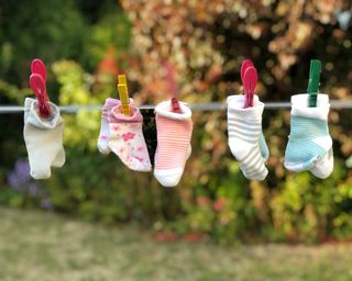 baby socks outside on a clothesline