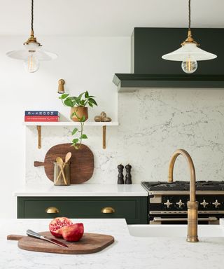 Modern kitchen with stone-effect wall tile and styled open shelving using plants and culinary objects