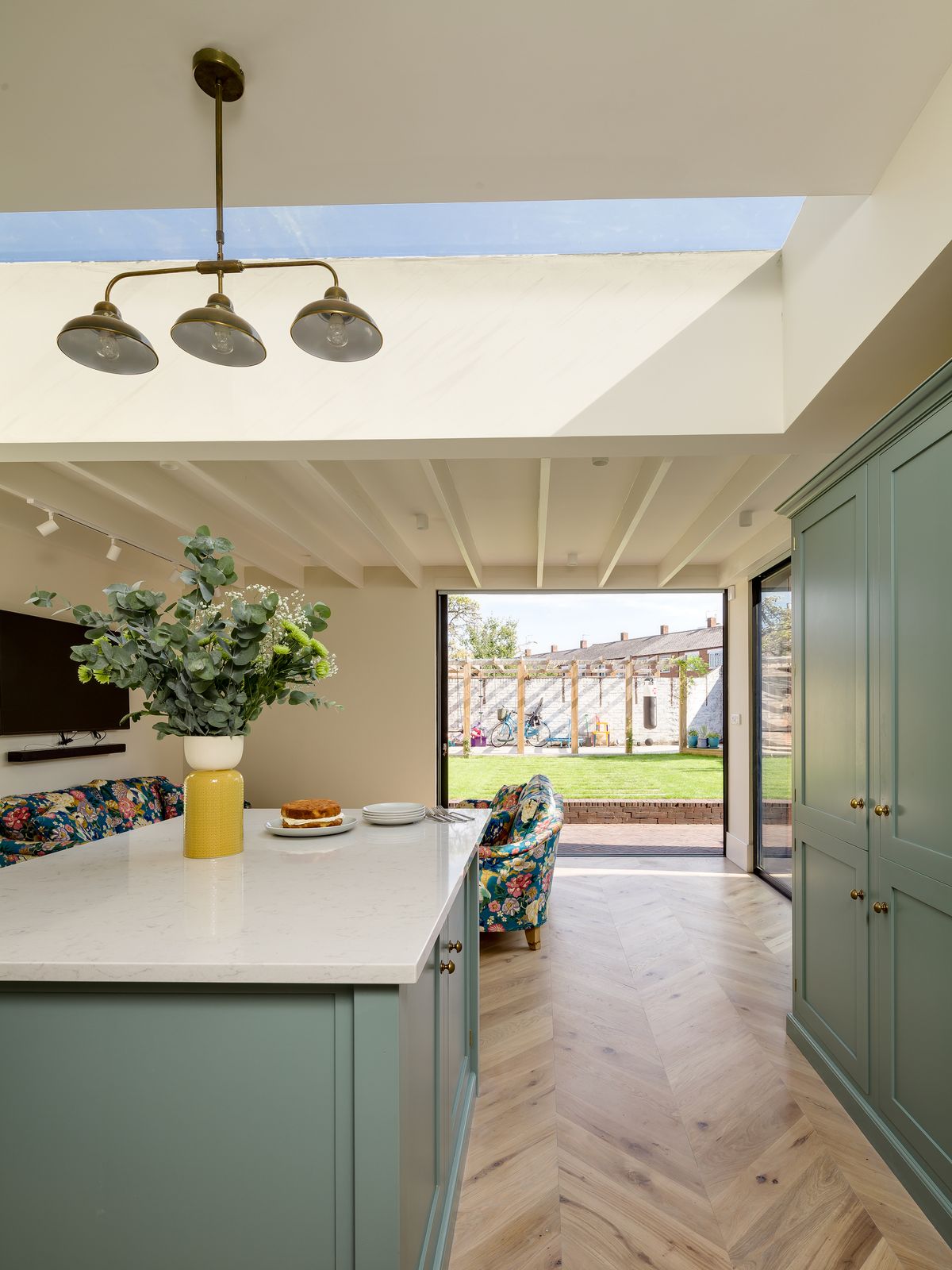 kitchen extension with blue units and sliding doors