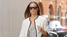 Pippa Middleton walks in London in 2017, wearing a white jacket