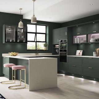 dark green kitchen with cabinets and worktop