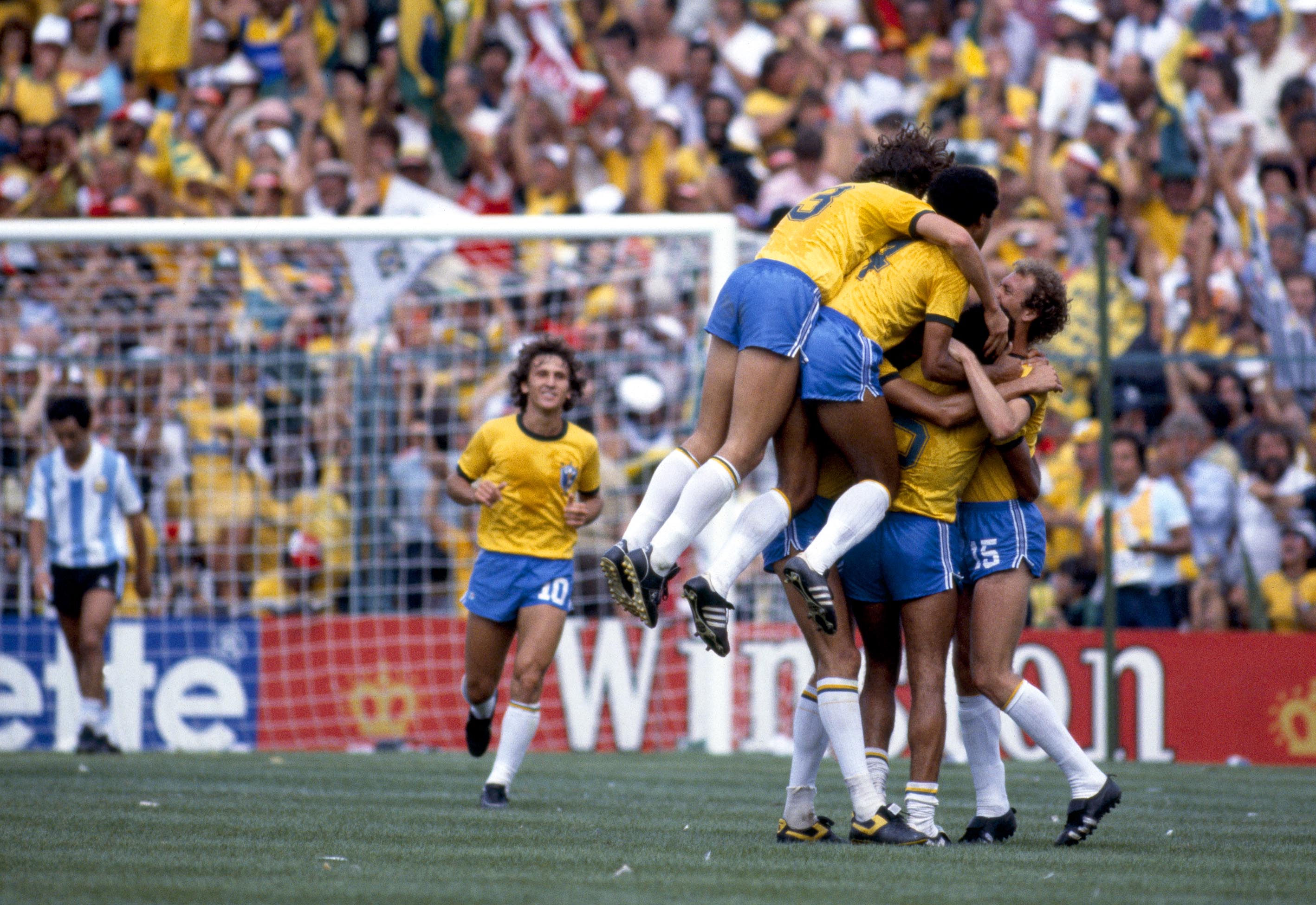 Brazil players celebrate a goal against Argentina at the 1982 World Cup.