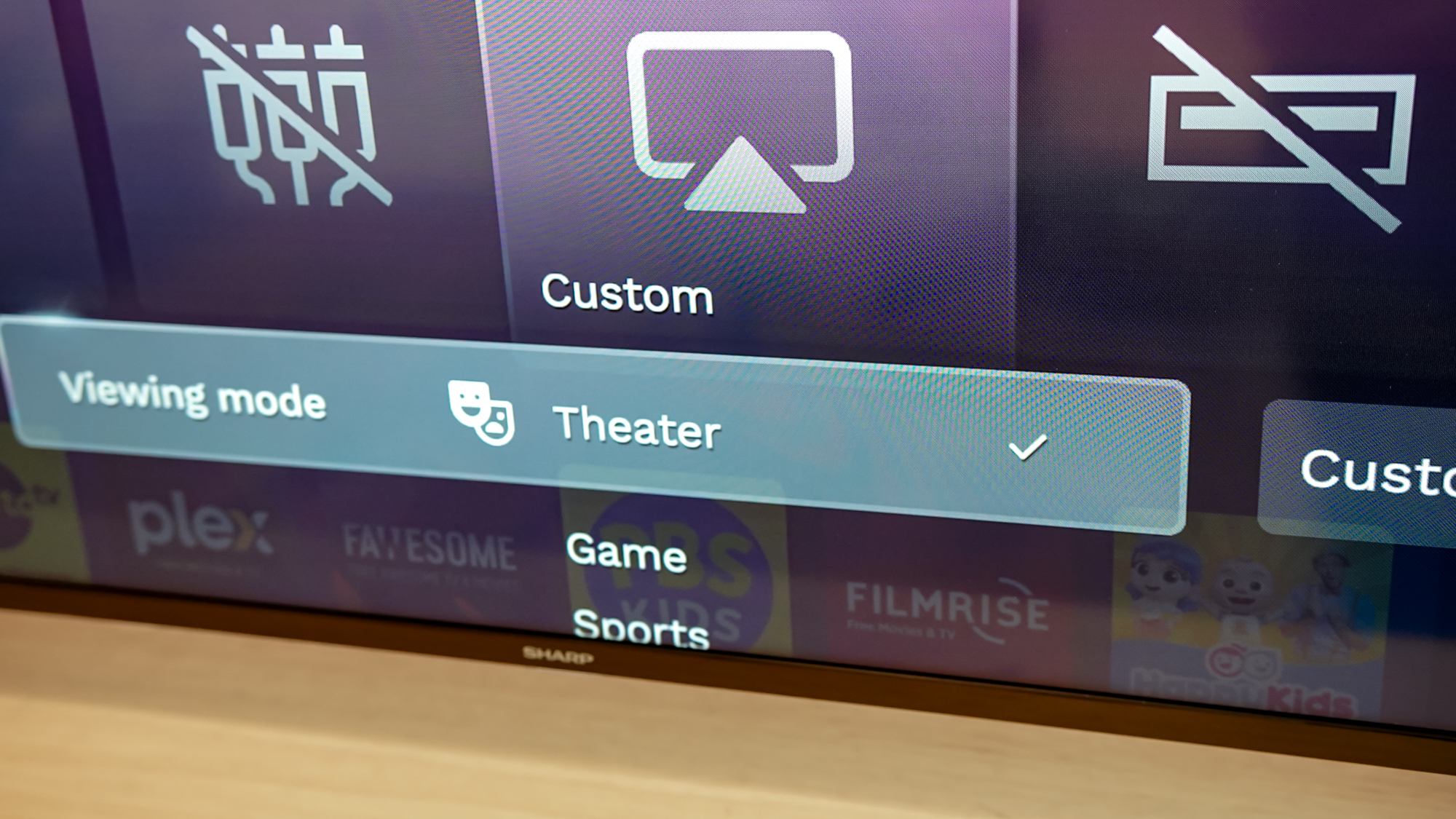 A Sharp Aquos QLED TV on a table