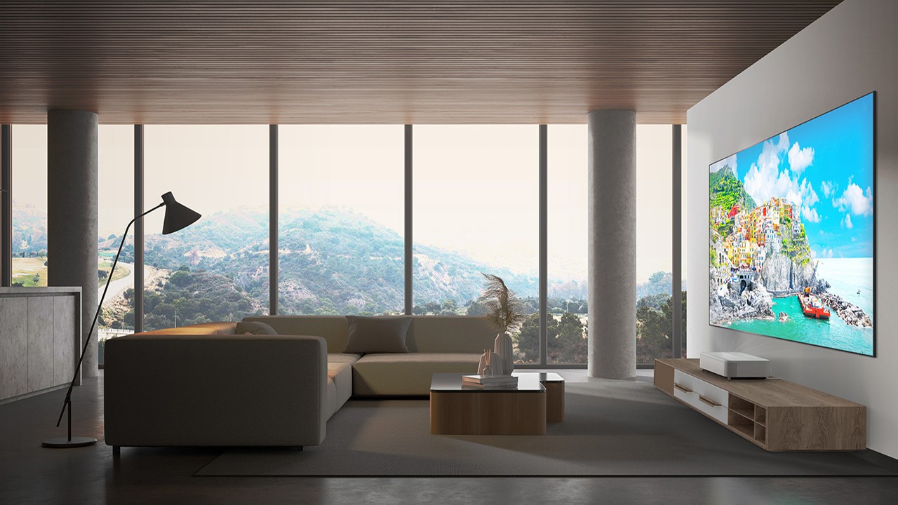 A modern living room with an Epson EH-LS970 projecting onto a wall-mounted screen