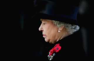 Britain's Queen Elizabeth II stands for a two-minute silence during the annual Remembrance Day service on November 14, 2004 in London, England. After a brief service members of The Royal Family, politicians and former members of the armed services laid wreaths to remember Britain's war dead.