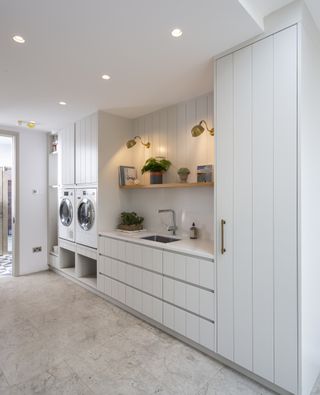 grey and white utility room with laundry facilities and flush ceiling lighting