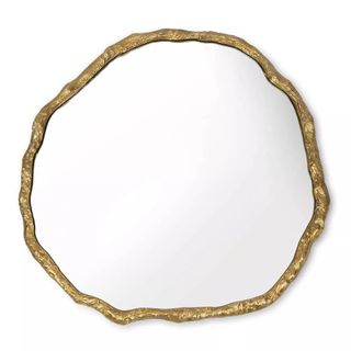 A gold asymmetrical mirror from Saks Fifth Avenue