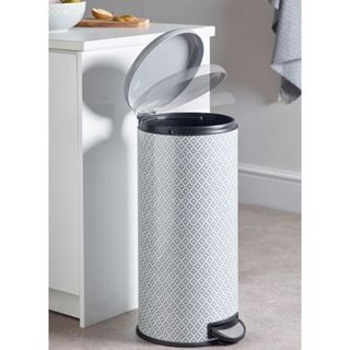 A grey and white patterned metal kitchen bin by Next