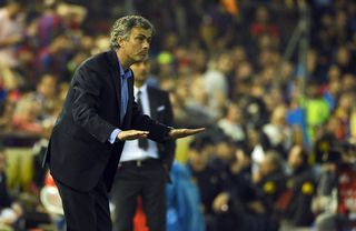 Real Madrid coach Jose Mourinho gestures during the 2011 Copa del Rey final against Barcelona.