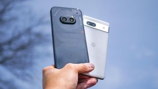 Nothing Phone 2a and Pixel 7a in hand.