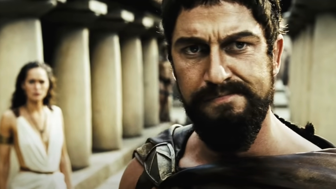 Lena Headey watches as Gerard Butler stands stoically in 300.