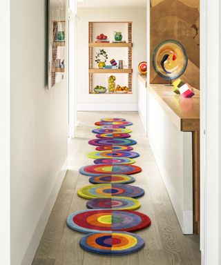 Entryway with multicolored runner with circular elements