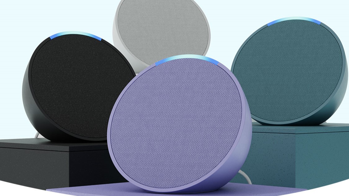 Echo Pop smart speakers in blue, white, black, and purple