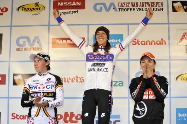 Helen Wyman celebrates atop the podium at Koppenbergcross