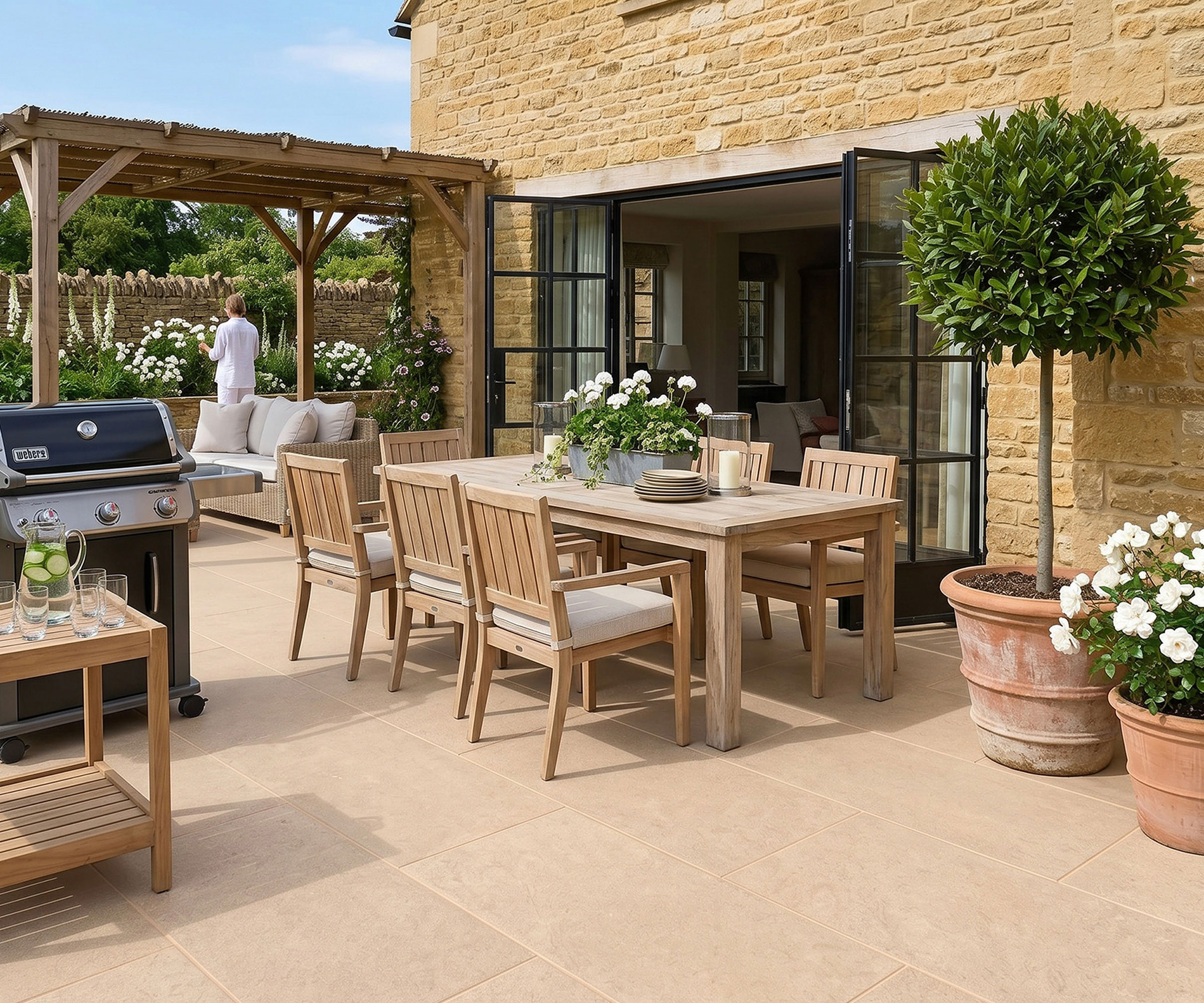 limestone effect paving on large patio with barbecue