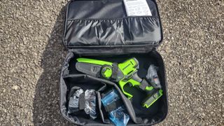 The Greenworks 24V 6" Brushless Pruning Saw and its accessories.