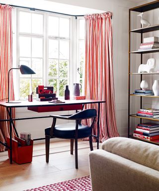 Home office ideas in a living room, with stripy curtains