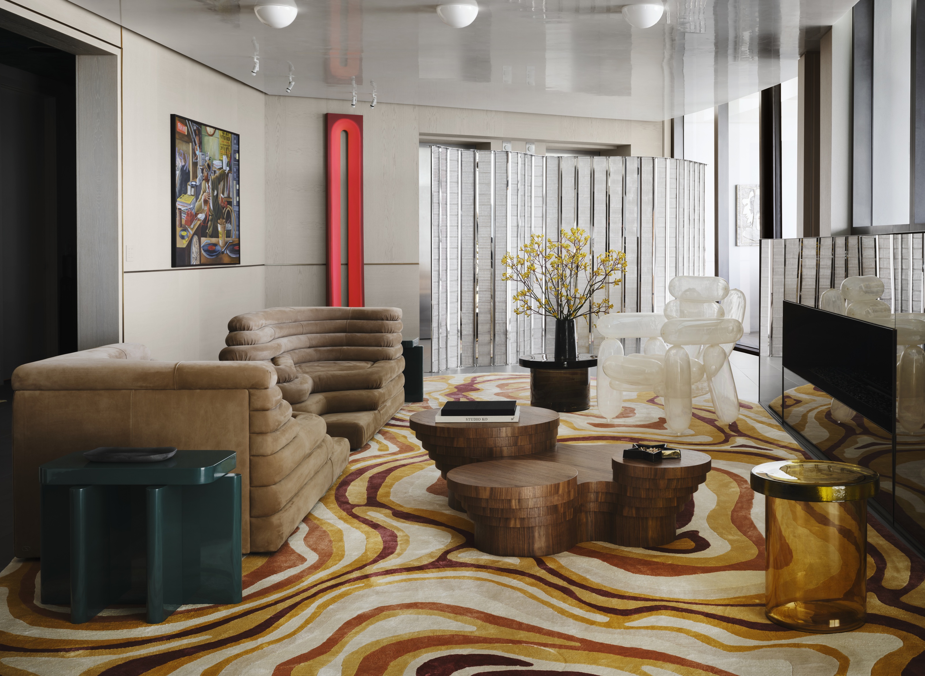 a disco era apartment with swirling floors and metallic finishes
