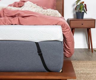 Corner of the ViscoSoft Active Cooling Copper Topper with duvet, pillows, and blanket.